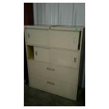 Lateral file cabinet with upper sliding door