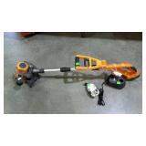 Works brand cordless weed eater with charger and 2