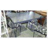 Rough iron glass top patio table, with four