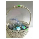 Handled basket full of assorted accent gems.