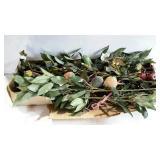 Box of faux branches. Berries and larger fruit.