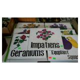Seven wooden painted garden signs. 18"×15" each.