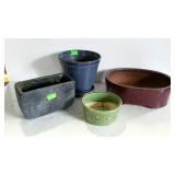 Four pottery planters. Assorted shapes, sizes and