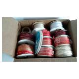 Small box of seasonal ribbon. Mostly narrow