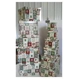 Stack of eleven nested Christmas gift boxes