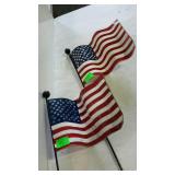 Two metal yard art flags. 30" high.