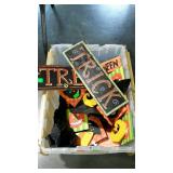 Halloween decor items in tote with locking lid.