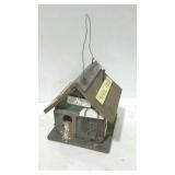 Birdhouse in shape of schoolhouse.