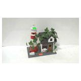 Birdhouse in shape of bait shop and lighthouse.