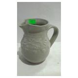 Grey pottery pitcher, with vine decor design,