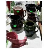 Pottery lot - five pitchers, and one Roseville