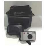 Leica C2 camera with case, booklet, and camera bag