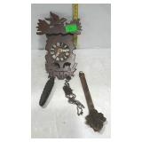 Small coo-coo clock with weight and pendulum, made