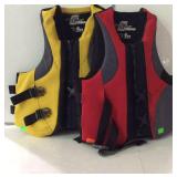 Two life Jackets, by Stearns one red one yellow