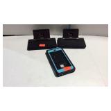 Two portable iPhone/pod/pad chargers and a phone