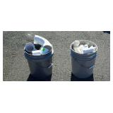Two buckets of pvc pipe fittings