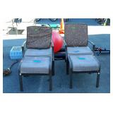 Two patio chairs with cushions, and foot stools,