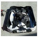 Thule cargo carrier, that folds up and has a bag