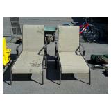 Two metal framed patio lounge chairs