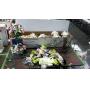 Group lot faux flowers and display pieces.