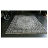 Beige toned area rug. Match to lot 800. 63" ×