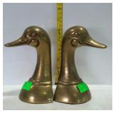 Brass duck head bookends, left one is splitting