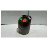 Early brown pottery whiskey sipping jug about