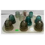 Collection of 10 glass electric insulators of
