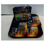 Toy lot: three Star Wars characters and a package