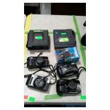Camera lot: two Polaroid and five 35mm cameras.