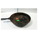 Lodge 10 1/2" cast iron skillet. Needs some