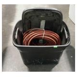 Air Hose in a storage tote with lid and a partial