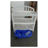 Baby changing station white color with a baby