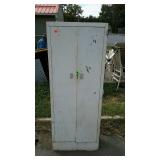 Metal storage cabinet measures 24 inches long, by