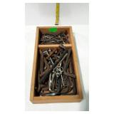 Wooden tray of assorted Allen wrenches. Many