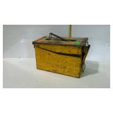 Metal ammo box with chippy yellow paint. Well