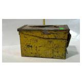Metal ammo box with chippy yellow paint. Well