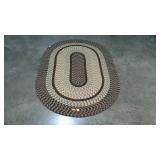 Braided room rug, measures 68 inches long, by 45
