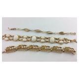 Three bracelets - white and gold tone patterns