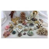 Group of costume jewelry brooches, some may be