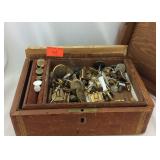 Leather jewelry box filled with cuff-links and