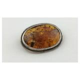Amber colored Brooch with  sterling silver frame