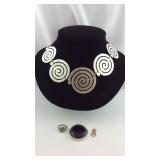 4 pieces of jewelry:  geometric shaped necklace,