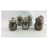 Six Sterling salt shakers, one and a half inches