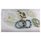 Four  necklaces and three bracelets