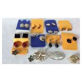 12 pairs earrings and three brooches