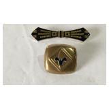 Boy Scouts buckle and a black and gold brooch