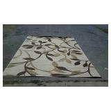 Wool area rug with flower design, measures 135
