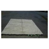 Surya wool carpet measures 8 feet long, by 10