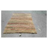 Indian style wool area rug, measures 97 inches